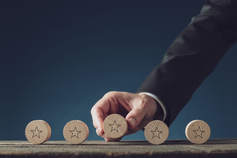 businessman lining wooden circle with star logo