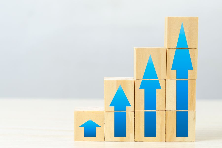 stack of wooden cube with upward arrow sign