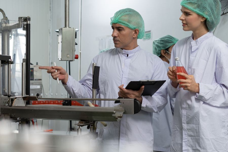 employee inspecting food metal detector