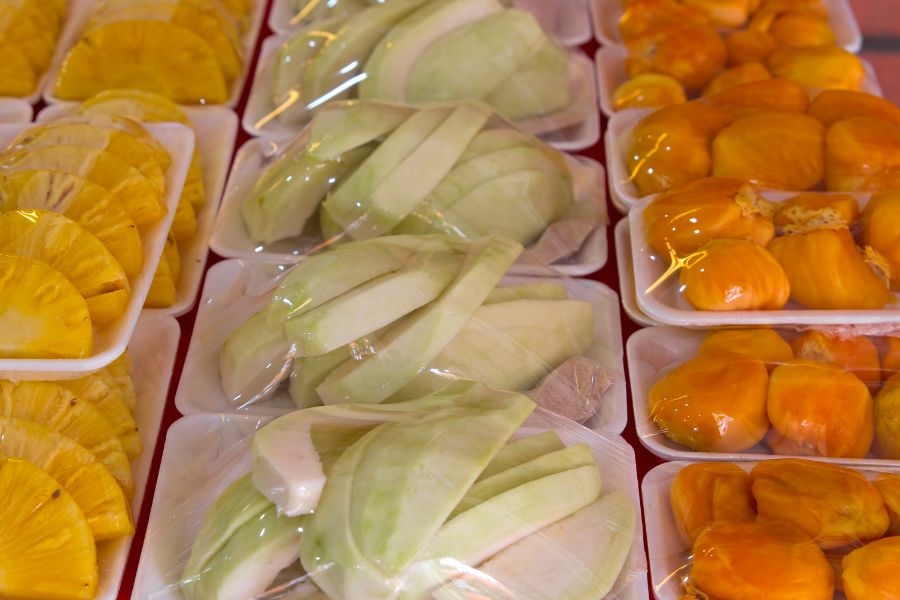 fresh fruits cut and shrink wrapped