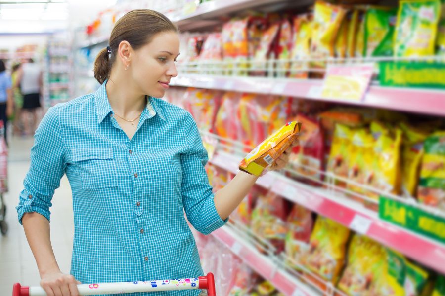 woman checking food labeling