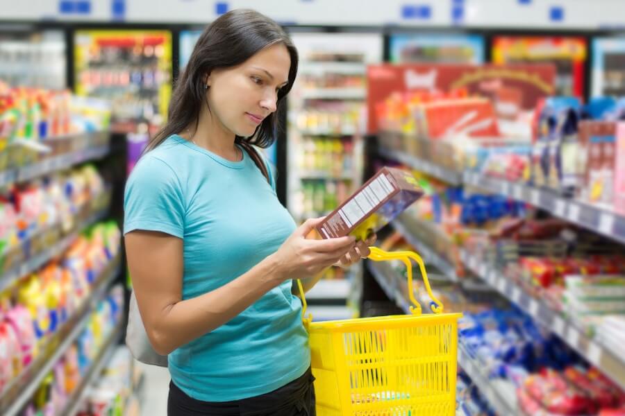 woman reading nutrition facts